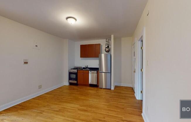 207 209 W 11 ST