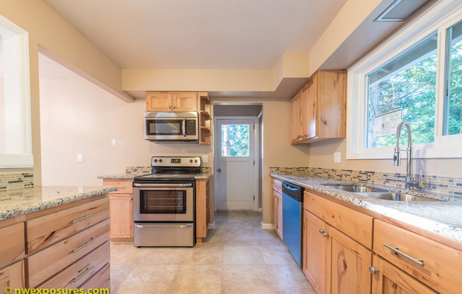 Charming 4-Bedroom Home with Dual Decks and Spacious Living Areas!