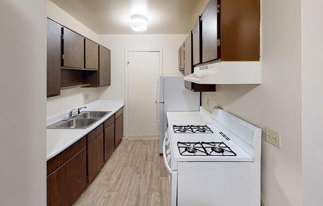 A kitchen with a gas stove at Glen Oaks Apartments, Michigan, 49442