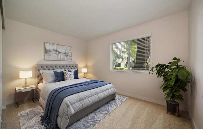 a bedroom with a bed and a window at Rush River Apartments, Sacramento, CA, 95831