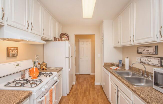 a kitchen with a stove and a sink