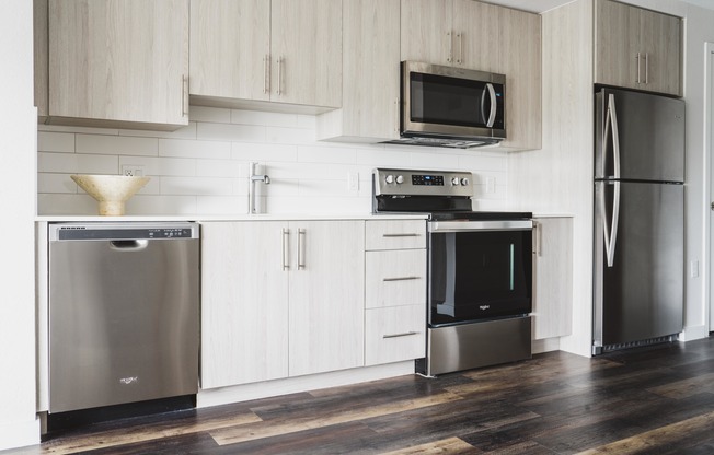 Residents can channel their inner chef in their artisan kitchen with quartz countertops and stainless-steel appliances.