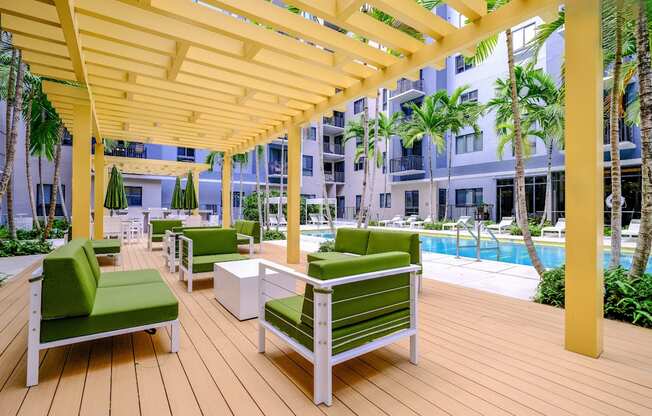 poolside, outdoor lounging area at Berkshire Coral Gables apartments