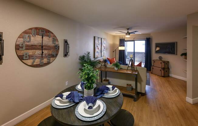 an open living room and dining room with a table and chairs