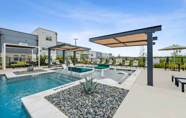 our apartments have a resort style pool with lounge chairs and umbrellas