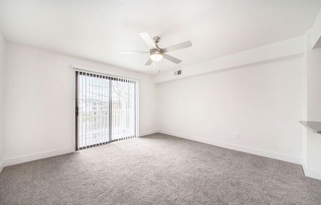 Renovated Living Room with Ceiling Fan at The Crossings Apartments, Grand Rapids, Michigan