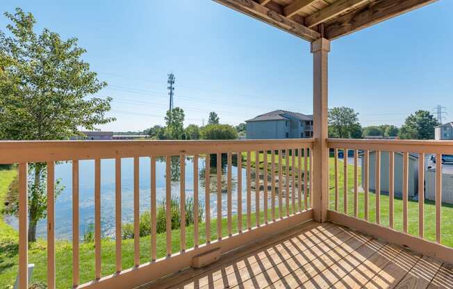 the view from the deck of a house overlooking the water