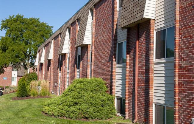 a row of windows on a brick building