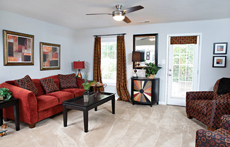 Spacious living room with door to private patio