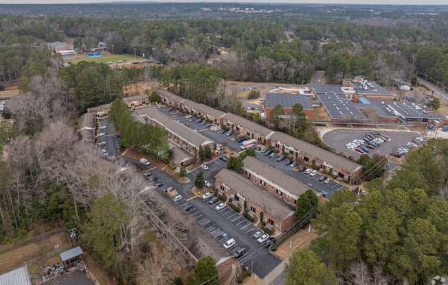 an aerial view of the parking lot of a building in a parking lot