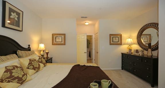 Spacious main bedroom with ensuite and walk-in closet at The Columns at Bear Creek, FL 34654