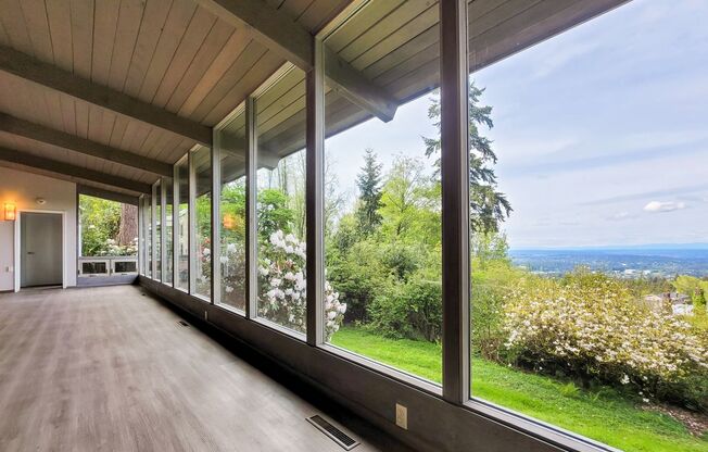 Vintage architectural home looking over Seattle and Bellevue metropolitan skyline.