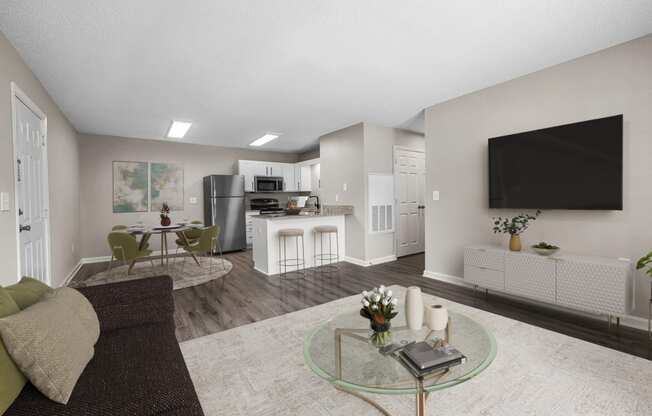 addison point interior staged model an open living room and kitchen with a large screen tv