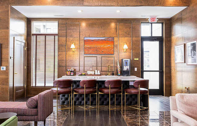 A brown wooden room with a table and chairs.