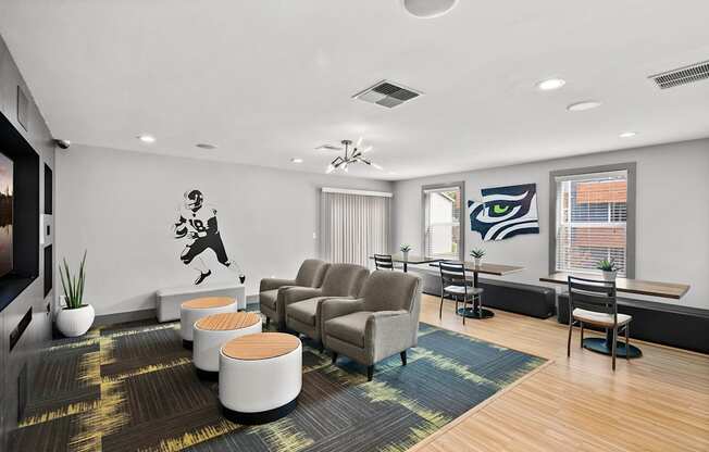A room with a ceiling fan and a wall mural of a man playing golf. at Northpoint Apartments, Washington, 98407