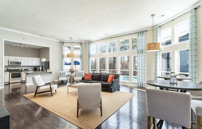 a living room with a couch and chairs and a table