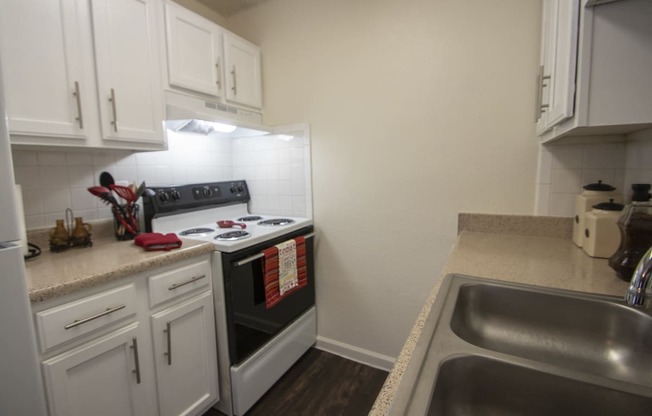 This is a photo of the kitchen in the 653 square foot 1 bedroom apartment at Princeton Court Apartments in Dallas, TX.