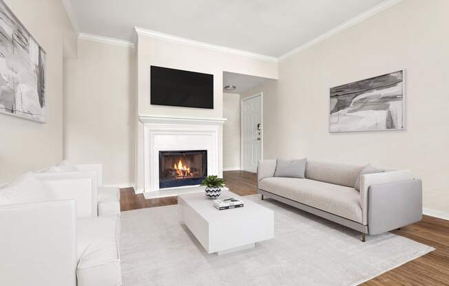 a living room with a couch and a fireplace at Villages of Cypress Creek, Houston, 77070