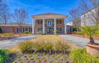 the front of a brick building with a large driveway and a front porch  at Cypress River, Ladson, SC, 29456