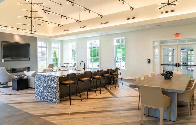 Lounge Featuring Couches and a Large Table