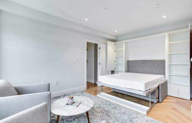 Furnished studio at the Century with murphy bed and extra bedside storage