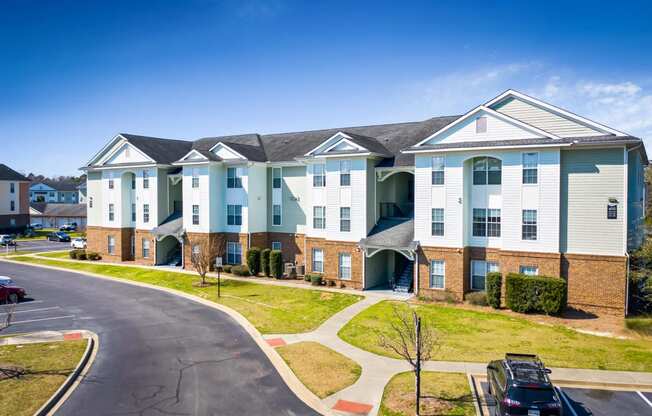 an apartment building with a street in front of it