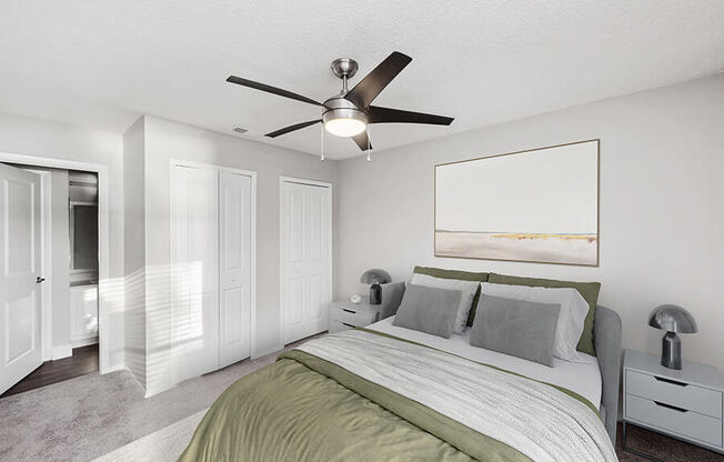 Model Bedroom with Carpet and attached Bathroom at Vue at Baymeadows Apartments in Jacksonville, FL.