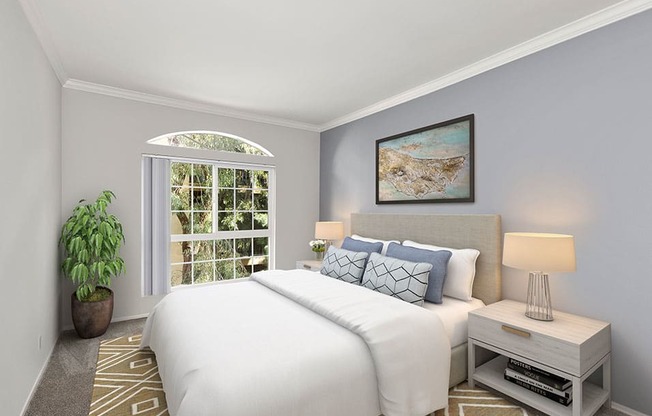 Carpeted bedroom featuring beautiful natural lighting and ceiling fan.