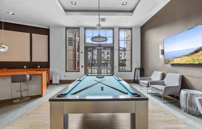 a games room with a pool table and a flat screen tv  at Harbor Pointe, New Jersey, 07002