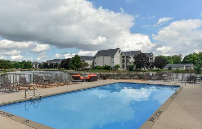 our apartments have a large swimming pool with chairs