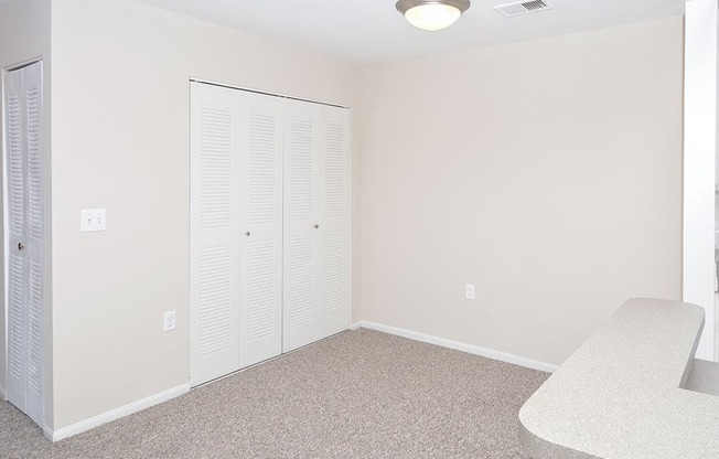 Dining Room Area with Accordion Style Closet