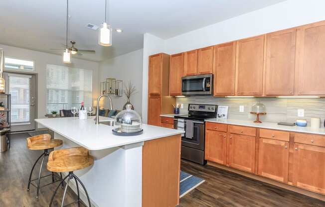 a kitchen with wooden cabinets and a white counter top