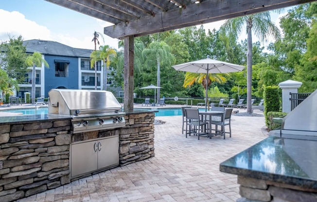 an outdoor grilling station at Verano apartments