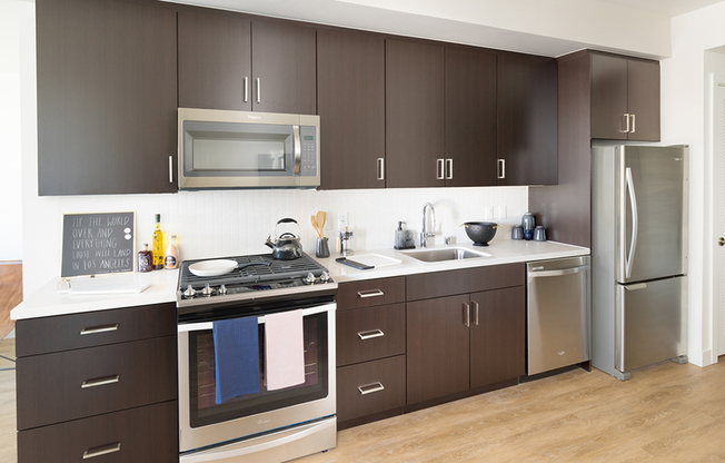 Stunning Kitchens with brown cabinetry and stainless steel appliances