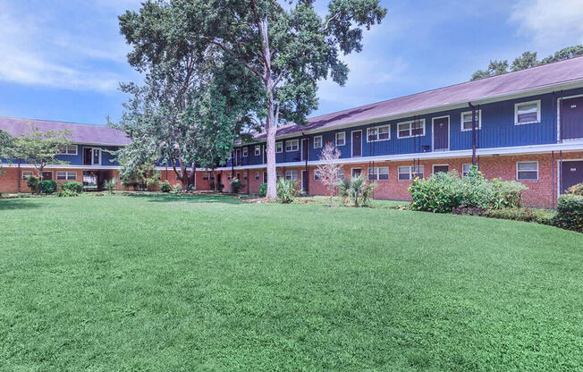 The Jaunt Apartments in Charleston South Carolina photo of exterior community building with grass area