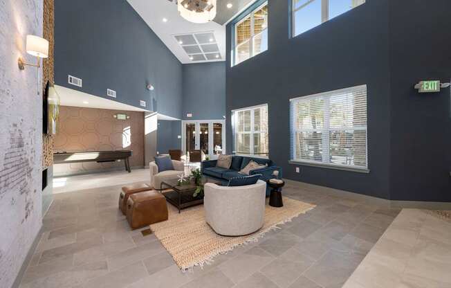 A spacious living room with a large couch and a coffee table.