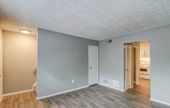 A room with a wooden floor and a white ceiling.