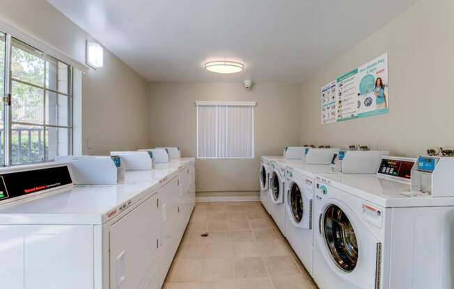 laundry room with washer and dryers at the casey, 2100 delgany,