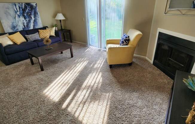 a living room with a couch and a fireplace
