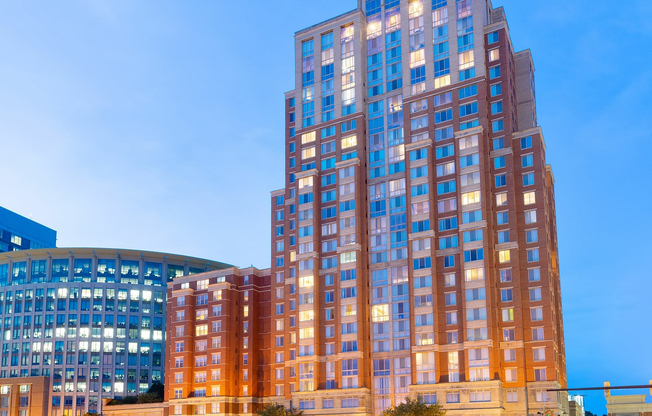 Meridian at Eisenhower Station illuminates the Alexandria skyline, offering stunning nighttime views of DC and the Masonic Temple.