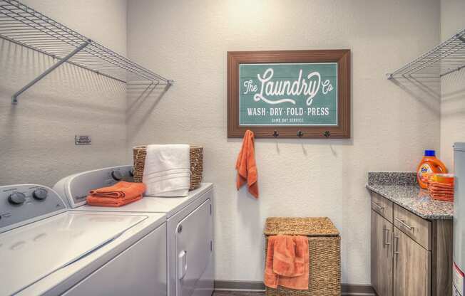 Laundry Room at The Strand Apartments in Oviedo, FL