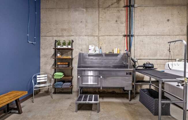 a kitchen with a sink and a table in a room