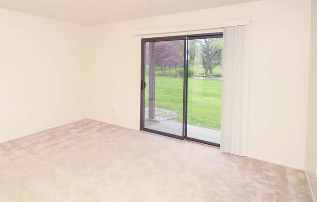 Spacious Living Room with a View at Madeira Apartments in Kalamazoo, MI