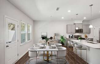 an open kitchen and dining room with a table and chairs