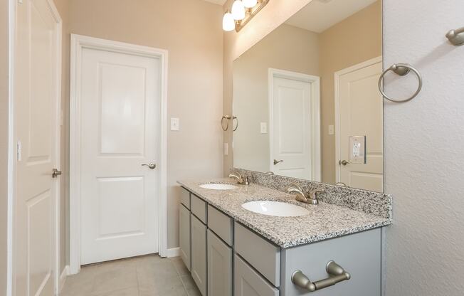 Bathroom With Vanity Lights at Clearwater at Balmoral, Texas