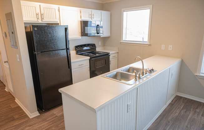 Spacious kitchen in your new home at Deerbrook Apartments in Wilmington, NC 28405