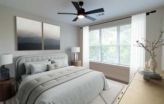 District at riverside apartment community bedroom with ceiling fan and large windows in Chattanooga, Tennessee