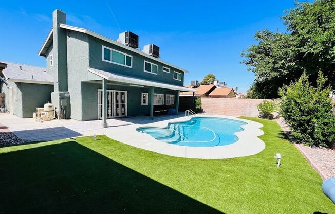 Gorgeous 4 Bed 2.5 Bath in a prime location! Home is over 2200 Sq Ft with a pool on a huge lot! Separate living room, dining room, and family room! Beautiful kitchen with stainless steel appliances built into the white cabinets!