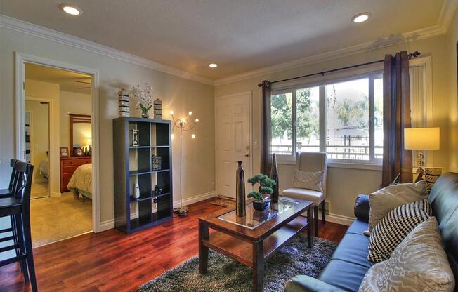 living room with large window at The Arbors at Mountain View, Mountain View, CA