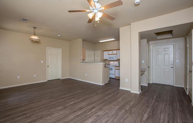 a large empty room with a wood floor